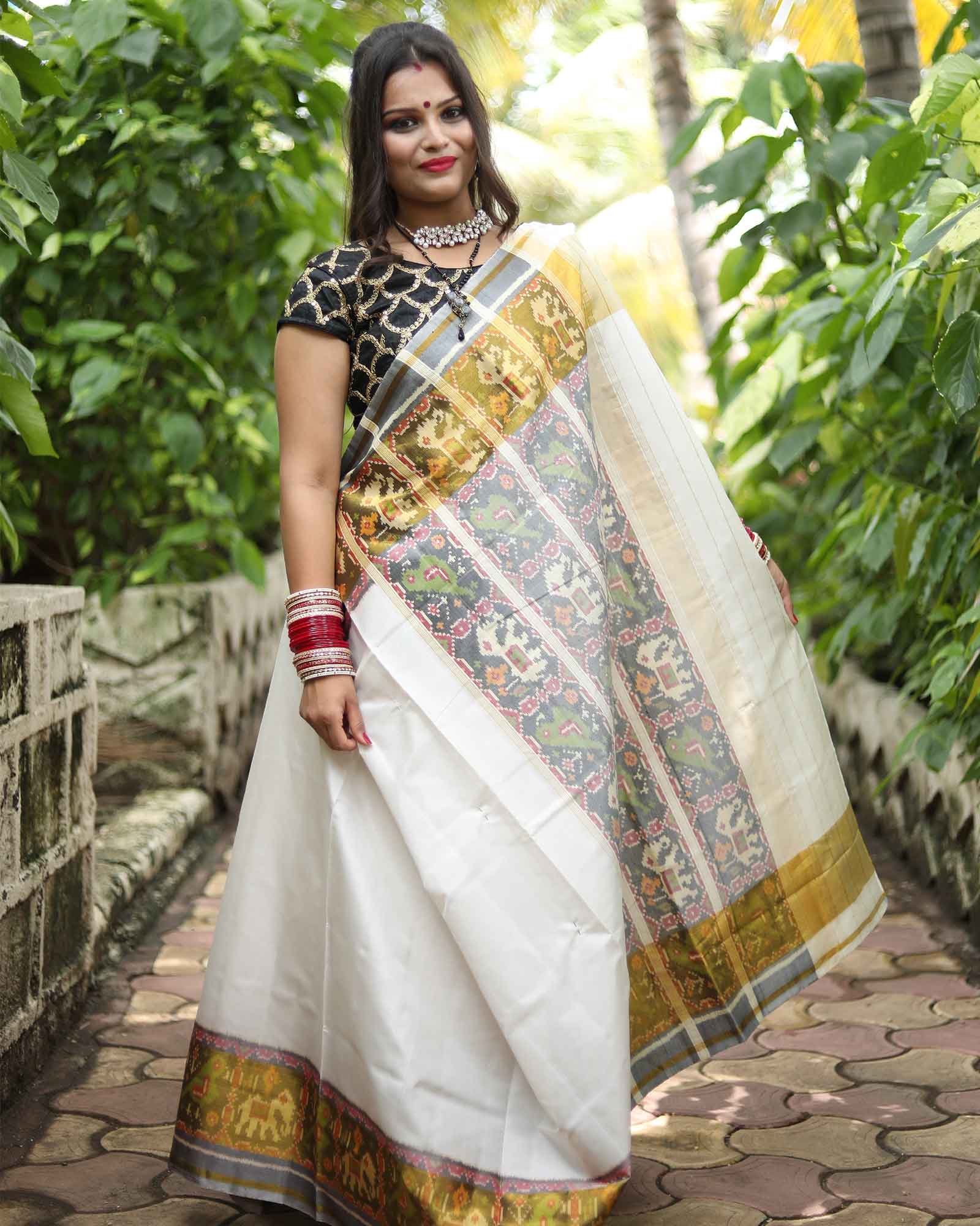 White Handcrafted Traditional Patola Saree with Hathi Popat Tissue Border 