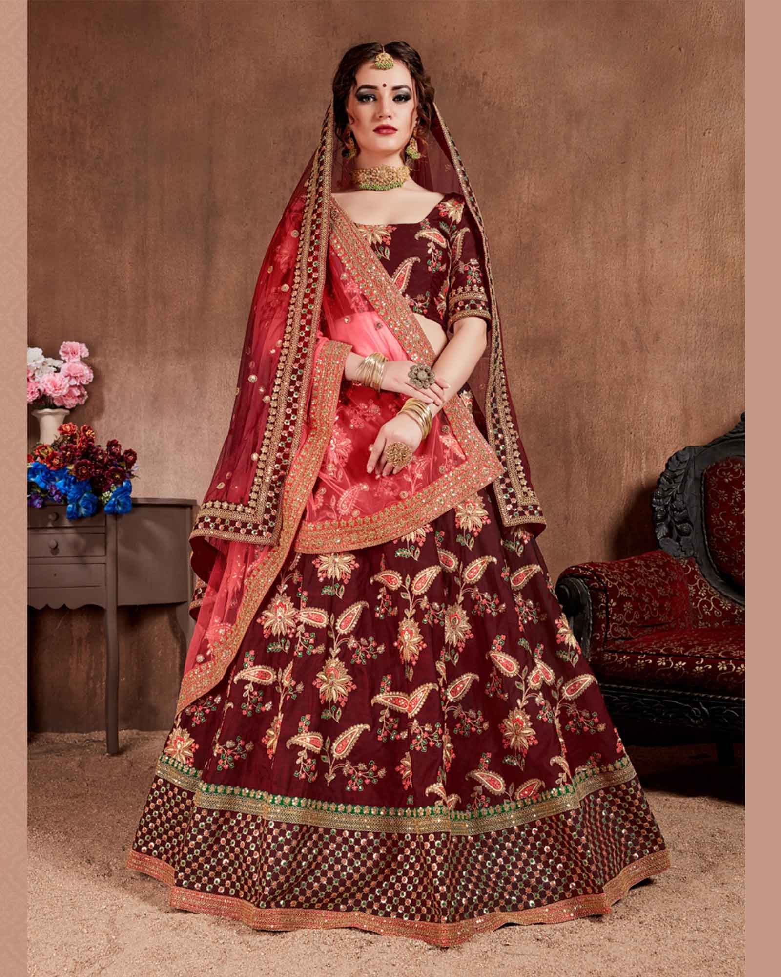 Maroon Colored Embroidered Tapeta Silk Bridal Lehenga Choli